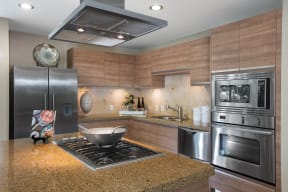 Apartments for Rent in Irvine, CA - Astoria at Central Park West Kitchen With Stainless Steel Appliances, Granite Countertops and Modern Finishes