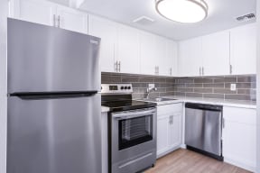 Apartments for Rent in Phoenix - Loramont on Thomas Kitchen with Stainless Steel Appliances and Modern Wood-Style Cabinets