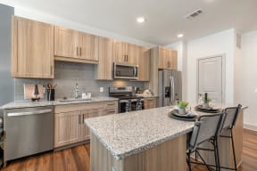 Fitted Kitchen With Island Dining at Alta Grand Crossing, Grand Prairie, TX, 75052