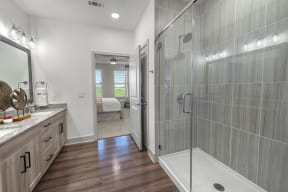 Walk-In Showers With Built-In Bench And Glass Enclosure at Alta Grand Crossing, Grand Prairie, Texas