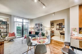 Living spaces with private patio/balcony at Halstead Tower by Windsor, 4380 King Street, VA
