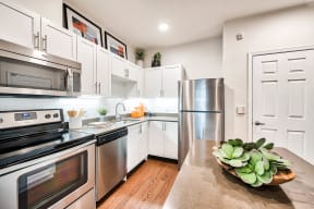 Renovated kitchens with stainless steel appliances at Reflections by Windsor, Redmond, WA