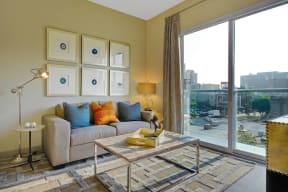 Large windows with views of Downtown LA from Living Room at South Park by Windsor, 90015, CA