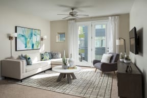 Bright living spaces with ceiling fans at The District, 80222