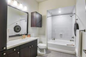 Spacious Bathrooms with Granite Countertops at 1000 Grand by Windsor, 90015, CA