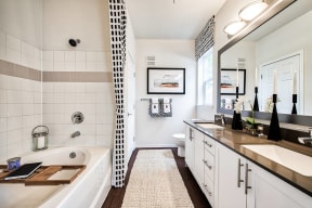 Bathroom With Bathtub And Abundant Storage at Reflections by Windsor, Redmond, Washington