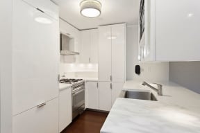 Designer kitchen with white lacquer at The Aldyn, NY, 10069
