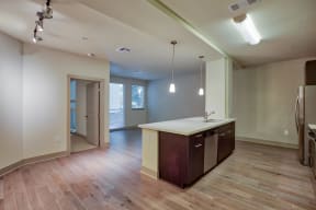 Wood-Style Flooring in Entry, Kitchen, Living and Dining Areas at South Park by Windsor, 90015, CA