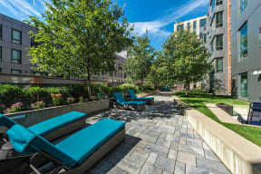 Garden Terrace with Lounge Chairs at The Victor by Windsor, Massachusetts, 02114