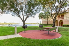 Grilling Area with Pond Views at Windsor at Miramar, Miramar, Florida
