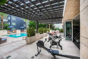 Outdoor Spin Bikes With A Pool View at South Park by Windsor, 939 South Hill Street, Los Angeles