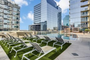Swimming Pool with Sundeck and Lounge Chairs at Glass House by Windsor, 75201, TX