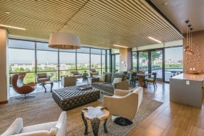 Clubroom with Multiple TVs Overlooking the Pool Deck at 1000 Speer by Windsor, Colorado, 80204