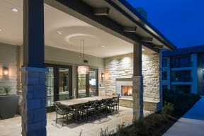 Open-Air Dining Porch with Fireplace at Windsor Lantana Hills, Austin, TX