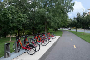Ride a bike on Four Mile Run trail near IO Piazza by Windsor, 2727 South Quincy Street, VA