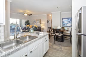 Stunning kitchens include quartz countertops and custom-patterned tile backsplash at Windsor Addison Park, Charlotte, North Carolina