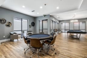 Resident clubhouse game lounge featuring game table