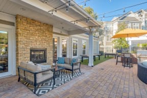 Outdoor living area featuring a fireplace at Windsor Herndon, Herndon, VA