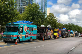 Food trucks parked near the Jordan by Windsor in Dallas, TX