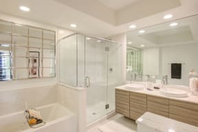 Spacious soaking tub and frameless glass enclosed shower in select master bathrooms at Windsor at Pembroke Gardens, Florida