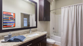 Framed mirrors are standard and add an upscale touch to your home. at Eleven by Windsor, Austin