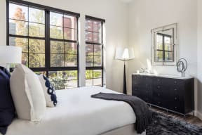 Bedroom With Expansive Windows at Edison on the Charles by Windsor, Waltham, Massachusetts