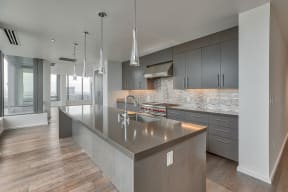 Kitchen with high end finishes at The Bravern, 688 110th Ave NE, WA