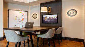 Conference table and TV at The Ridgewood by Windsor, Fairfax, Virginia