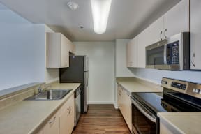 Wood floors & stainless steel appliances available in select apartment homes