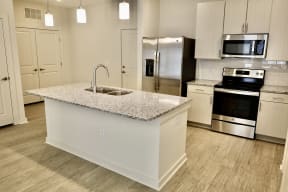 Apartments for Rent in Ladson SC - Fully Equipped Kitchen with Stylish Interiors and Convenient Amenities such as Fridge, Stove, and Microwave
