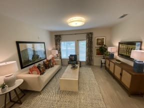 Apartments in Ladson SC - Open Space Living Room with Stylish Interiors and Hardwood Floors