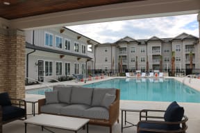 Summerville SC Apartments for Rent - Duke of Charleston - Resort-Style Swimming Pool Surrounded By Lounge Chairs Featuring a Comfortable Lounge Area