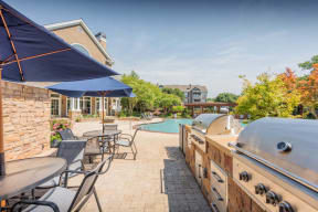 Lex at Brier Creek apartments in Morrisville, NC, grilling station by pool