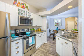 Lex at Brier Creek apartments in Morrisville, NC, kitchen with stainless steel appliances