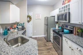Lex at Brier Creek apartments in Morrisville, NC, spacious kitchen with stainless steel appliances