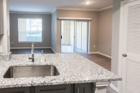 Renovated Kitchen overlooking living room and dining room located at The Moorings Apartments, League City TX 77573