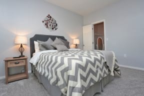 Bedroom with cozy bed at The Moorings, League City, 77573