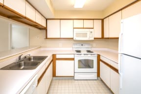 Kitchen with Sink, Stove, Microwave, Refrigerator