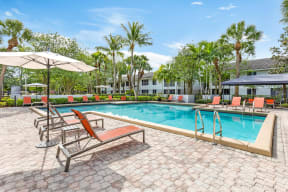 Resort style pool with large sundeck with plenty of lounge areas
