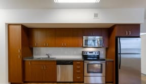 Apartments for Rent Nob Hill Portland Oregon -The Cordelia Apartment's Stainless Steel Kitchen Fully Equipped with Microwave, Fridge, and Dishwasher