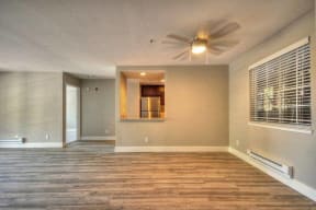 One Bedroom Apartments in Larkspur CA - Larkspur Courts Apartments Living Room with a Ceiling Fan, Wood Flooring, and More