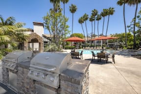 San Clemente Apartments for Rent - Rancho Del Mar - Grilling Station Near Pool with Two Grills, Tables, Chairs, and Umbrellas