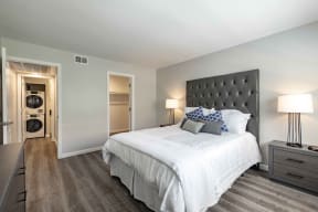Rancho Del Mar Apartments in San Clemente, CA with Hardwood Floors, Closet, White Walls, and Access to the Bathroom
