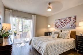 One Bedroom Apartments in Phoenix, AZ - Village at Lakewood Bedroom with Large Window and Private Balcony/Patio