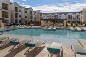 Swimming Pool And Sundeck at McCarty Commons, San Marcos, Texas