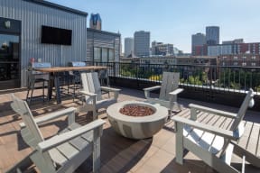 Gas firepit on outdoor rooftop overlooking city