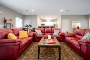 Community clubhouse with fireplace and seating at Northridge Apartments in Gretna, NE