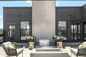 Outdoor firepit and rooftop lounge - Nuvelo at Parkside Apartments