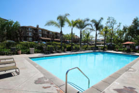 Pet-Friendly Apartments in Chino Hills CA-Missions at Chino Hills Sparkling Pool with Lounge Chairs, Spa, and Many More Amazing Community Amenities
