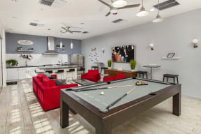 Clubroom kitchen and living area with TV and pool table